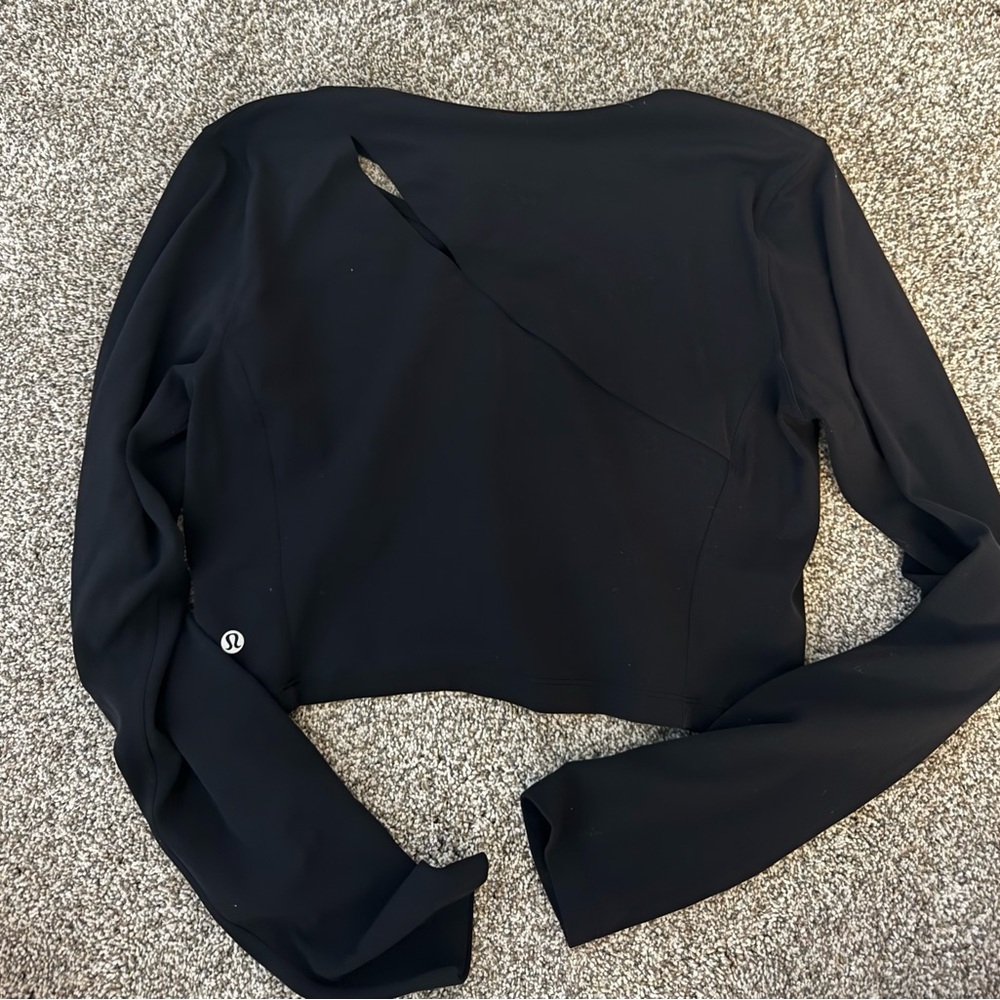 lululemon athletica Midnight Black Long Sleeve Top with sleek slit in it.